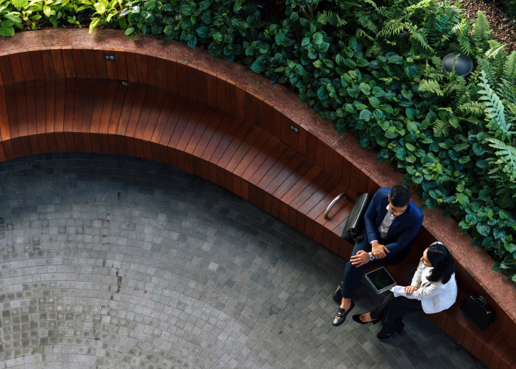2 people on bench outside
